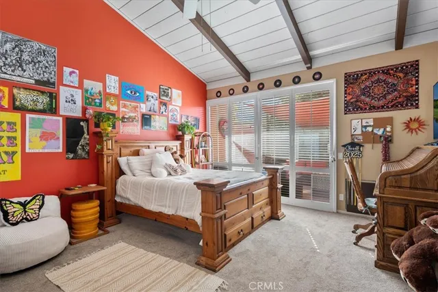 a view of a livingroom with workspace and a window