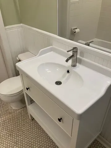 a bathroom with a bathtub and a sink