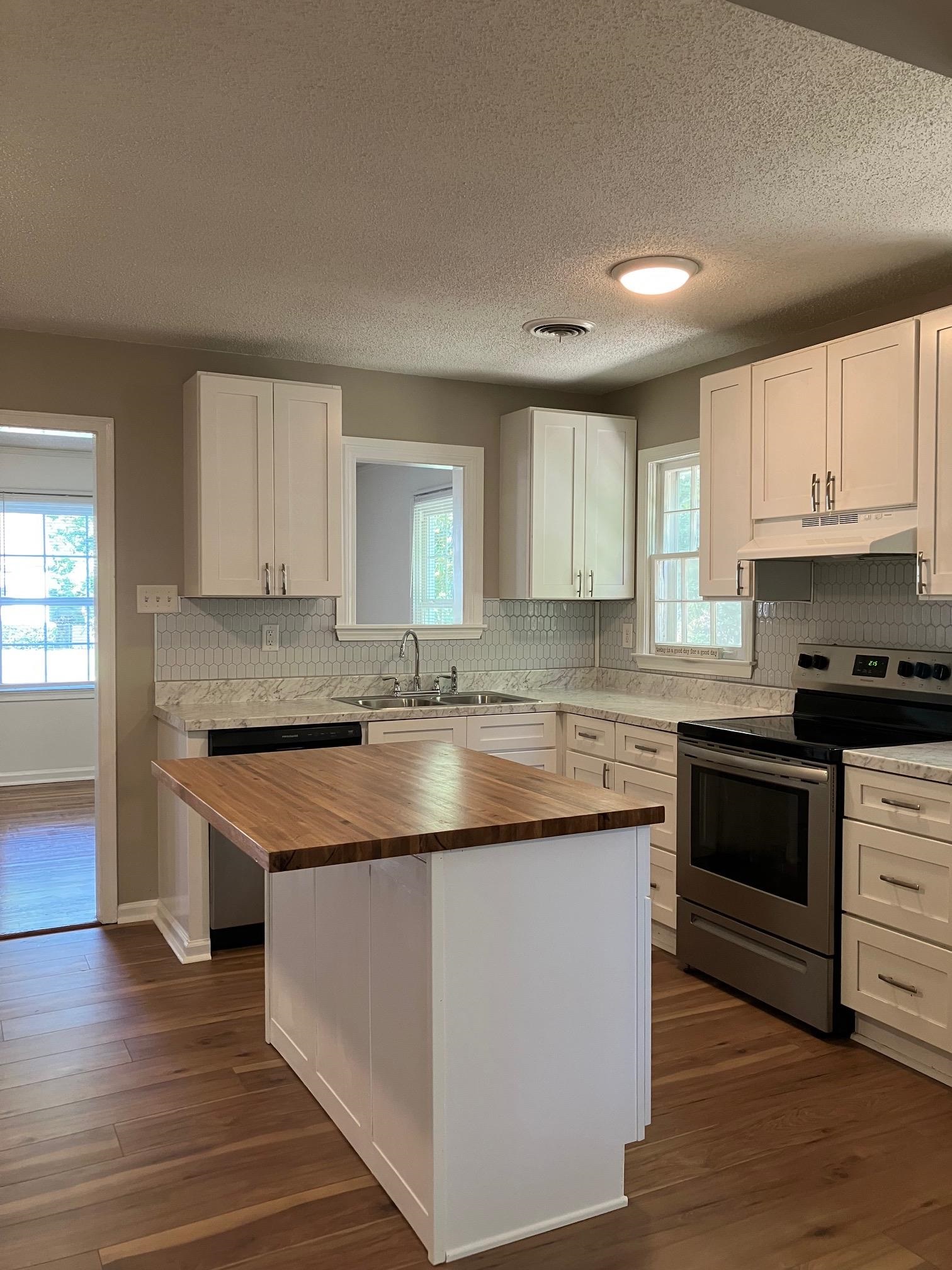 3815 Vanuys Road Memphis, TN 38111 - Photo 11 of 17 a kitchen with stainless steel appliances granite countertop a sink stove and cabinets