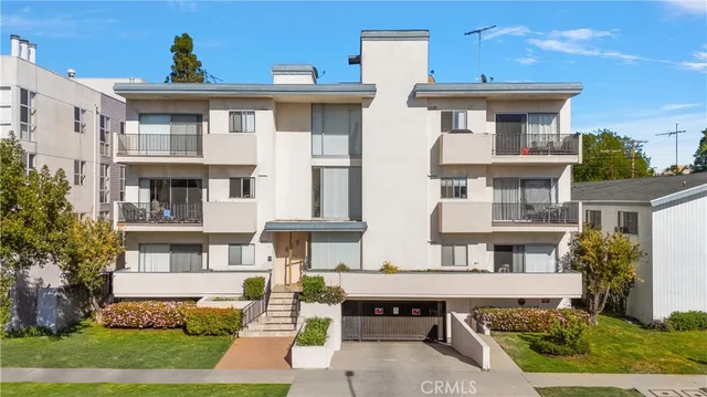 a view of a brick building next to a yard