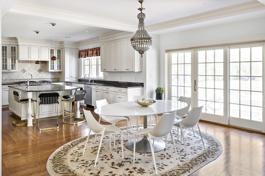 17 Kesseler Way Newton, MA 02467 - Photo 12 of 33 a view of a dining room with furniture a chandelier and wooden floor