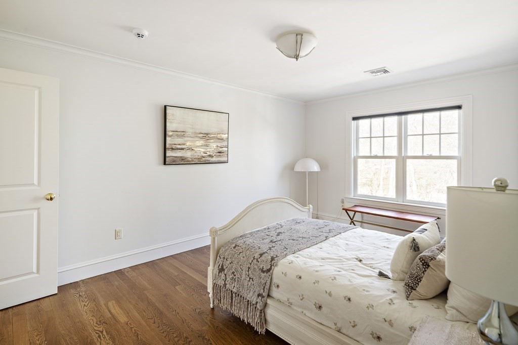 17 Kesseler Way Newton, MA 02467 - Photo 28 of 33 a bedroom with a bed and a window