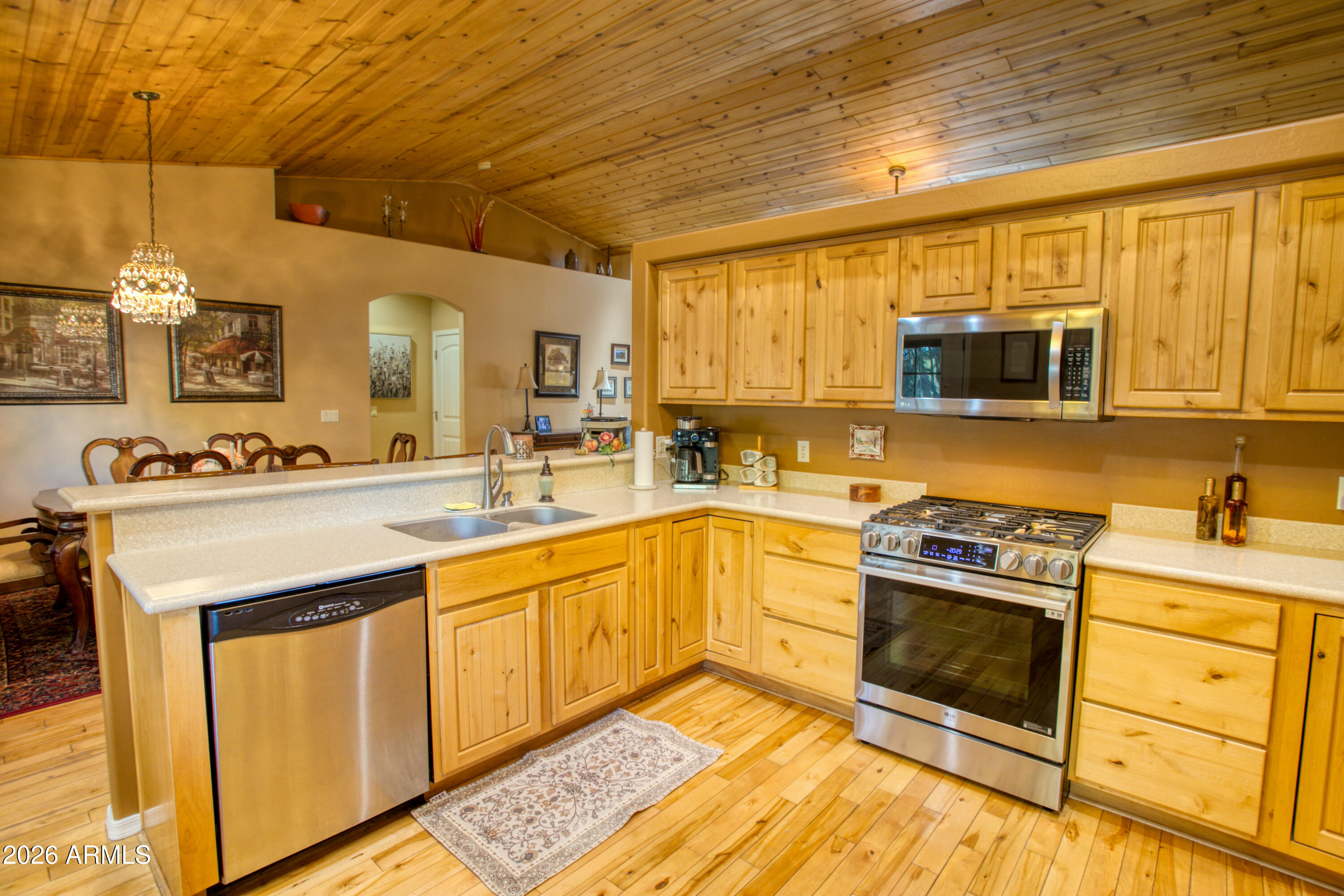 925 Wild Horse Road Show Low, AZ 85901 - Photo 12 of 40 a kitchen with stainless steel appliances granite countertop a stove a sink and a microwave