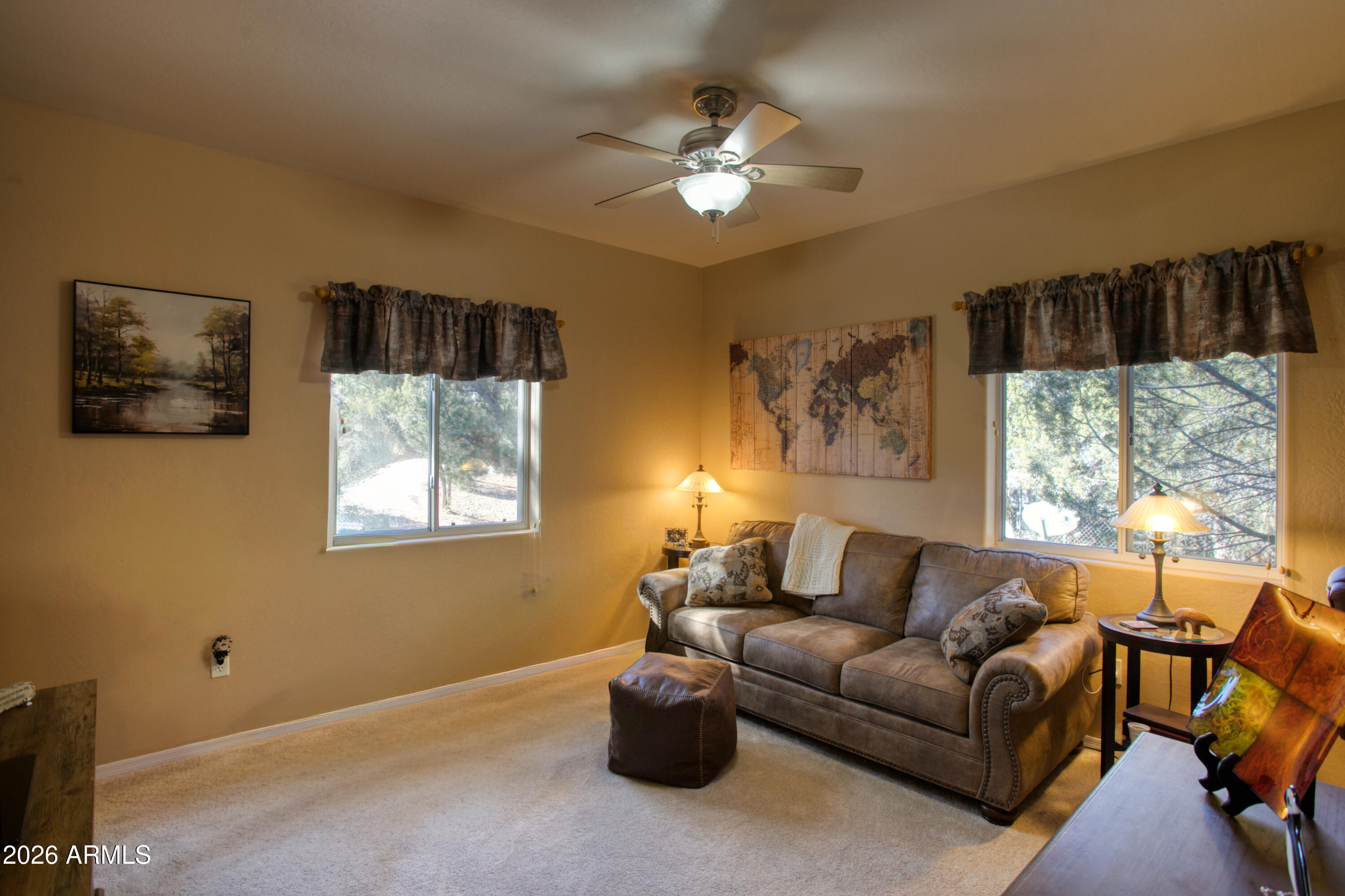 925 Wild Horse Road Show Low, AZ 85901 - Photo 20 of 40 a living room with furniture a chandelier and a window