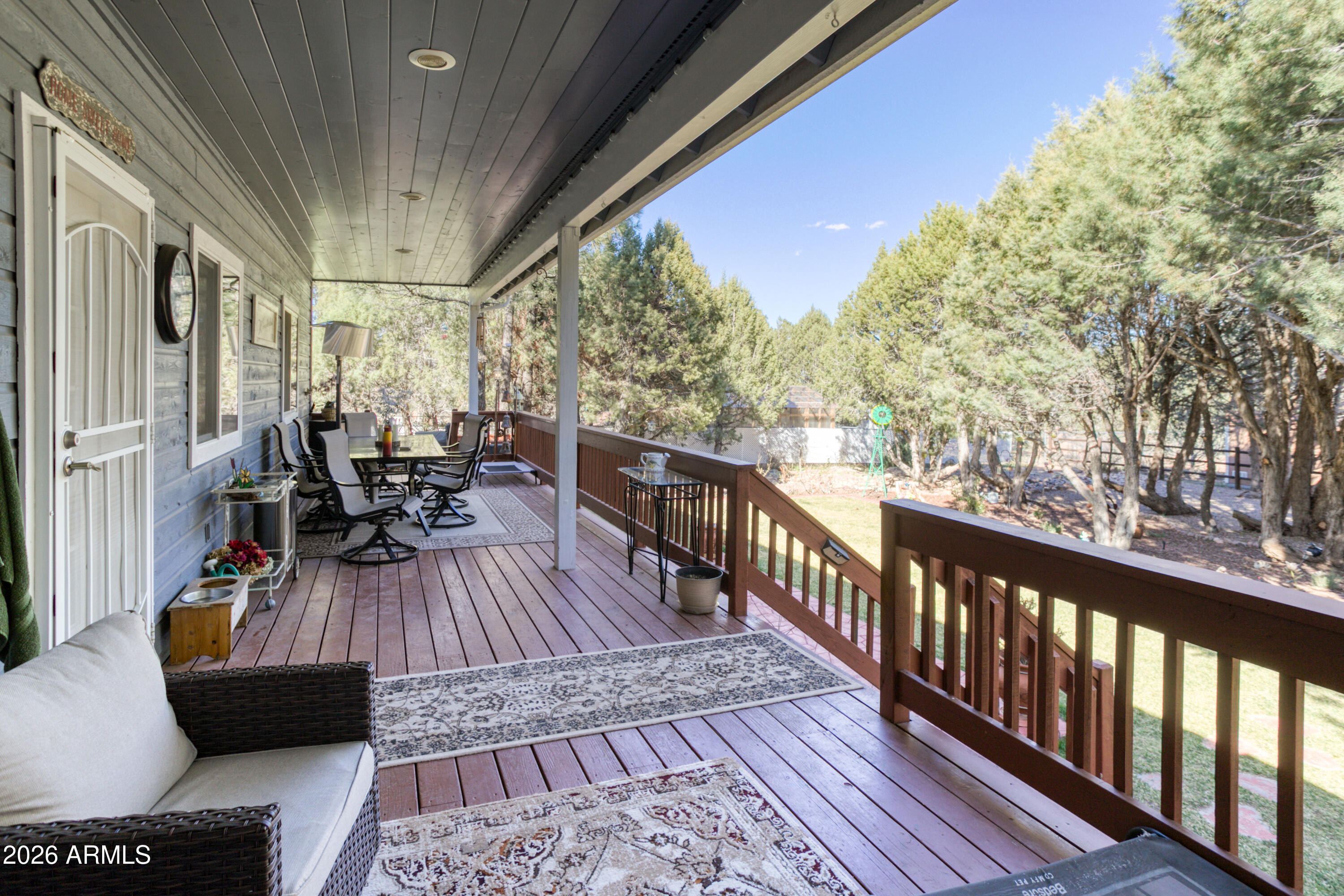 925 Wild Horse Road Show Low, AZ 85901 - Photo 22 of 40 a view of balcony with chairs and wooden fence