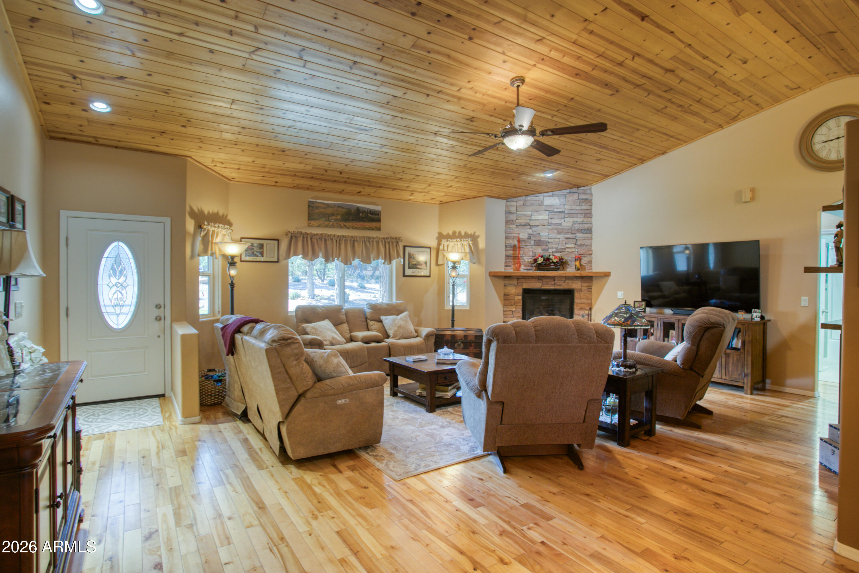 925 Wild Horse Road Show Low, AZ 85901 - Photo 5 of 40 a living room with fireplace furniture and a flat screen tv