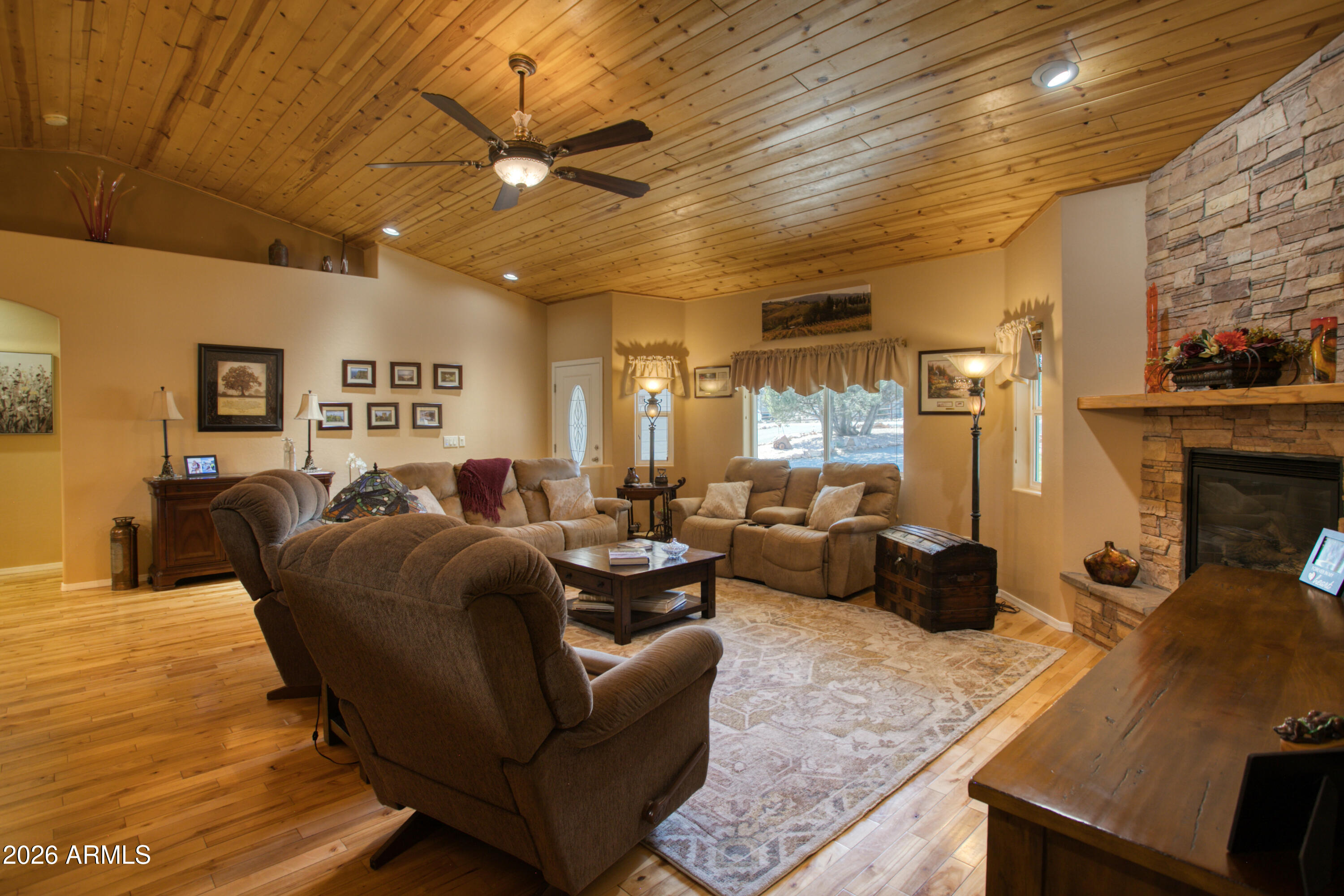 925 Wild Horse Road Show Low, AZ 85901 - Photo 8 of 40 a living room with furniture and a fireplace