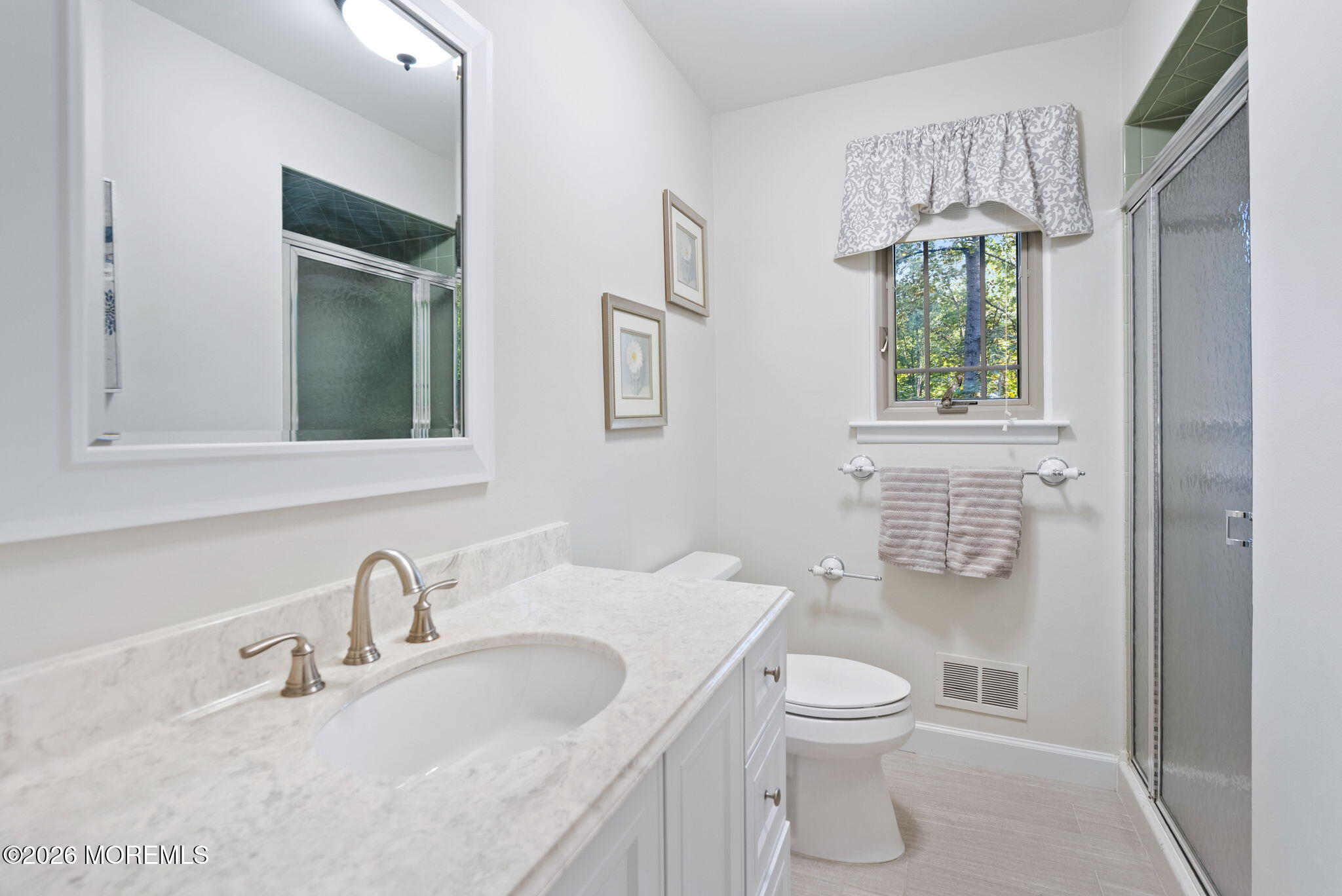21 Stoney Brook Road Holmdel, NJ 07733 - Photo 31 of 40 a bathroom with a granite countertop sink toilet a mirror and shower