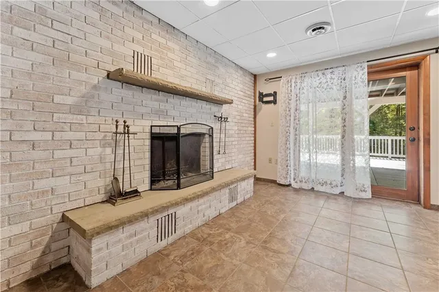 a view of an empty room with a fireplace