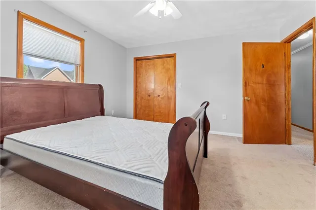 a bedroom with a bed and a dresser