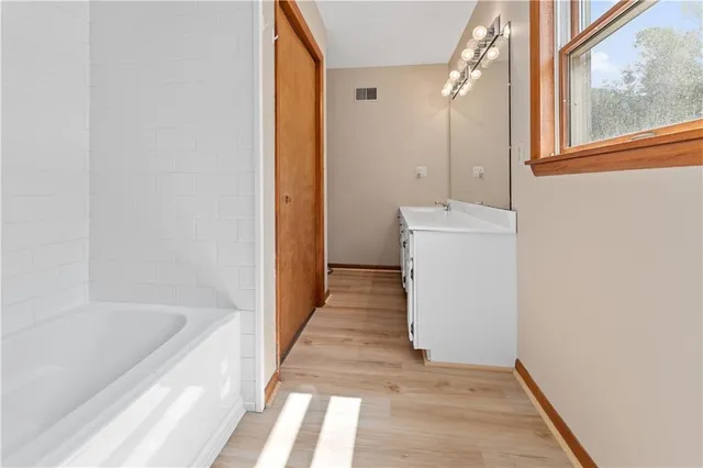 a bathroom with a sink and a bathtub