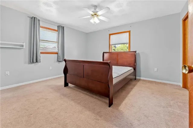 a room with a bed and a window