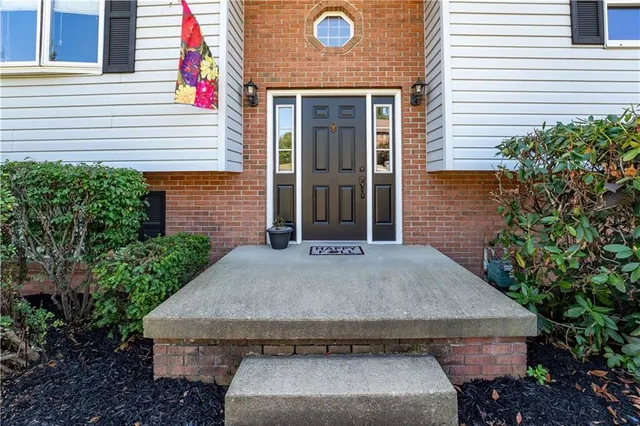 a front view of a house with garage