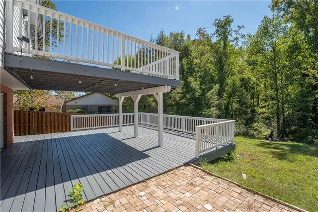 a view of a deck with wooden floor and yard