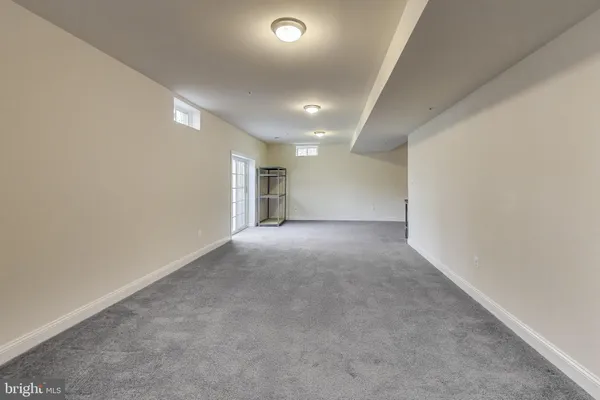 a view of a hallway with entryway door