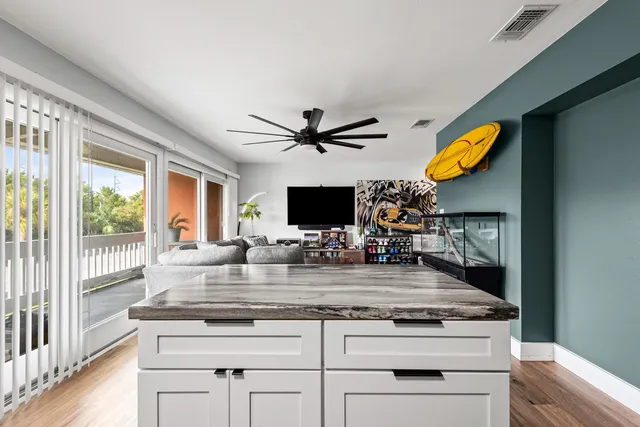 a kitchen with stainless steel appliances granite countertop a stove and a sink