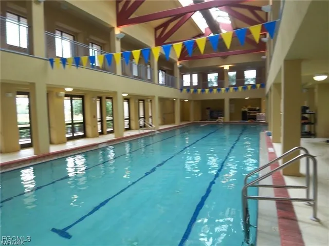 a view of swimming pool with a yard