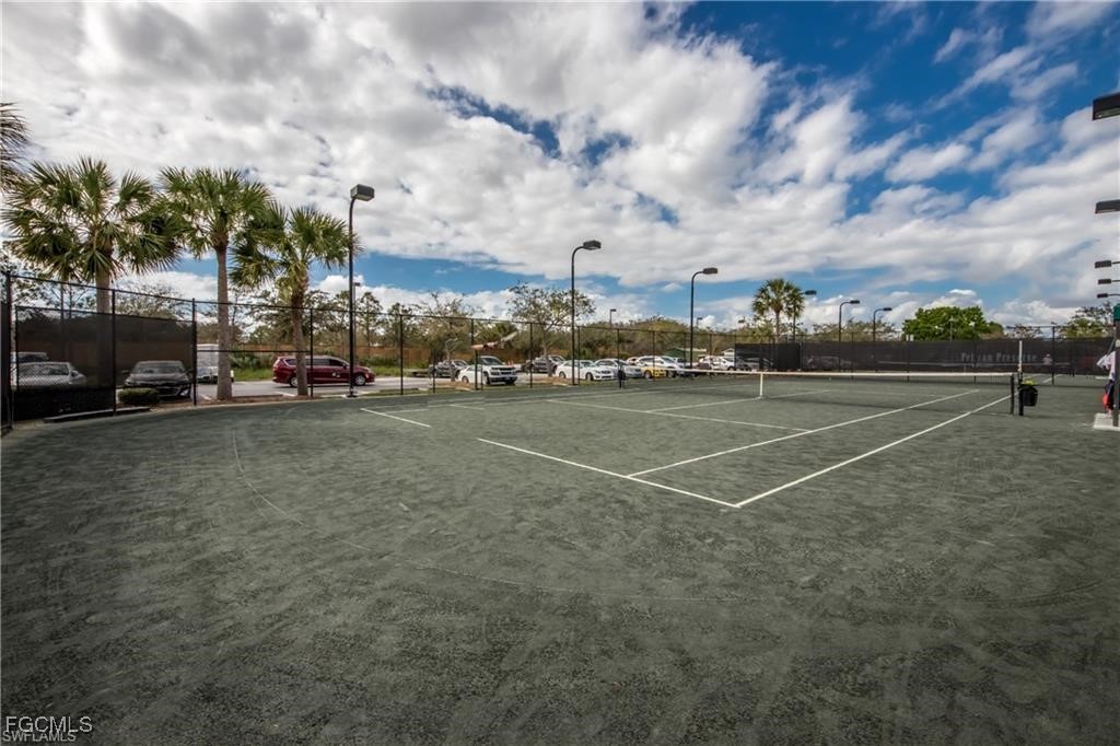 10711 Palazzo Way, Unit 203 Fort Myers, FL 33913 - Photo 23 of 24 a view of tennis court