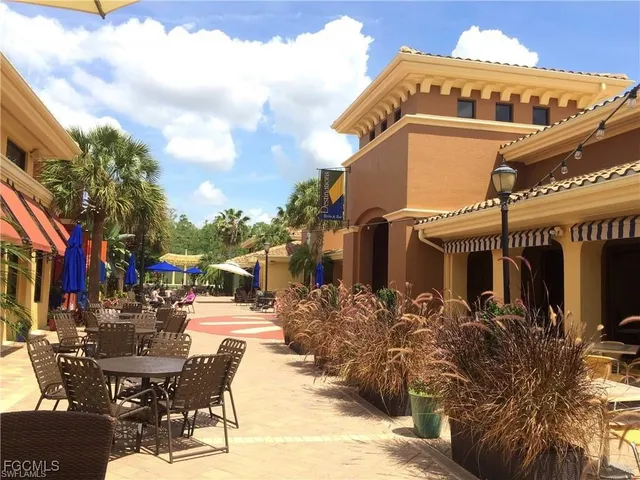 a view of a building with sitting area
