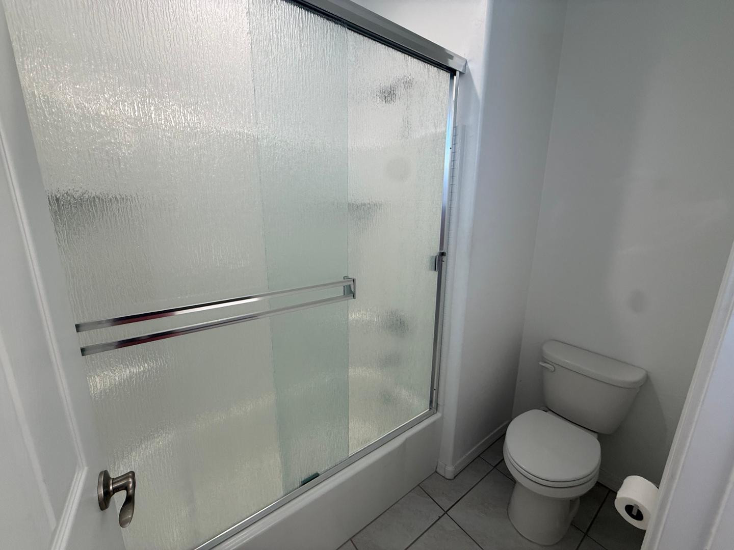 15744 West Jefferson Street Goodyear, AZ 85338 - Photo 5 of 26 a white toilet sitting next to a shower