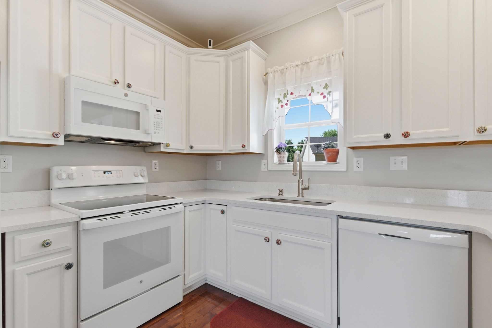 1503 Chapman Lane Spring Hill, TN 37174 - Photo 10 of 33 a kitchen with white cabinets and white appliances