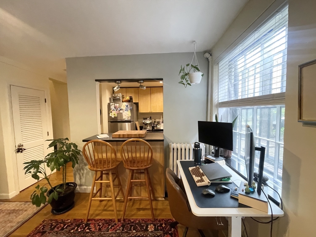 9 Primus Avenue, Unit 1 Boston, MA 02114 - Photo 5 of 19 a room with furniture a flat screen tv and a window