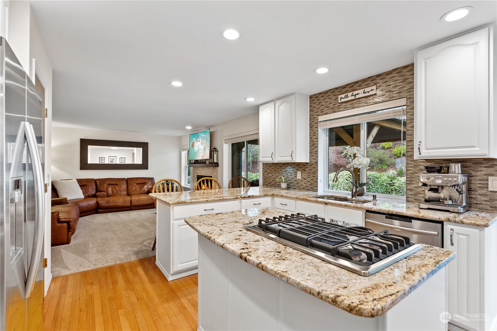 5316 152nd Place Southeast Everett, WA 98208 - Photo 13 of 37 a living room with furniture and a open kitchen