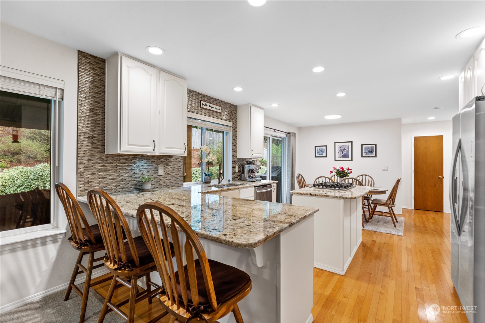 5316 152nd Place Southeast Everett, WA 98208 - Photo 15 of 37 a view of a dining room with furniture and wooden floor
