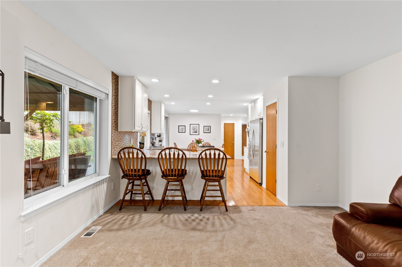 5316 152nd Place Southeast Everett, WA 98208 - Photo 16 of 37 a living room with furniture and a large window