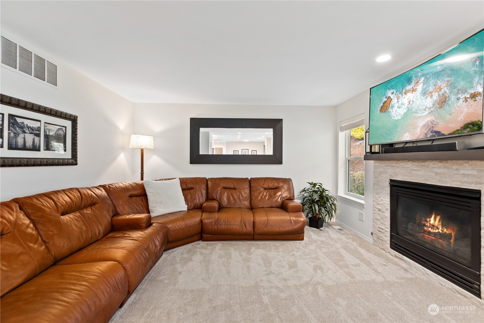 5316 152nd Place Southeast Everett, WA 98208 - Photo 18 of 37 a living room with furniture and a fireplace