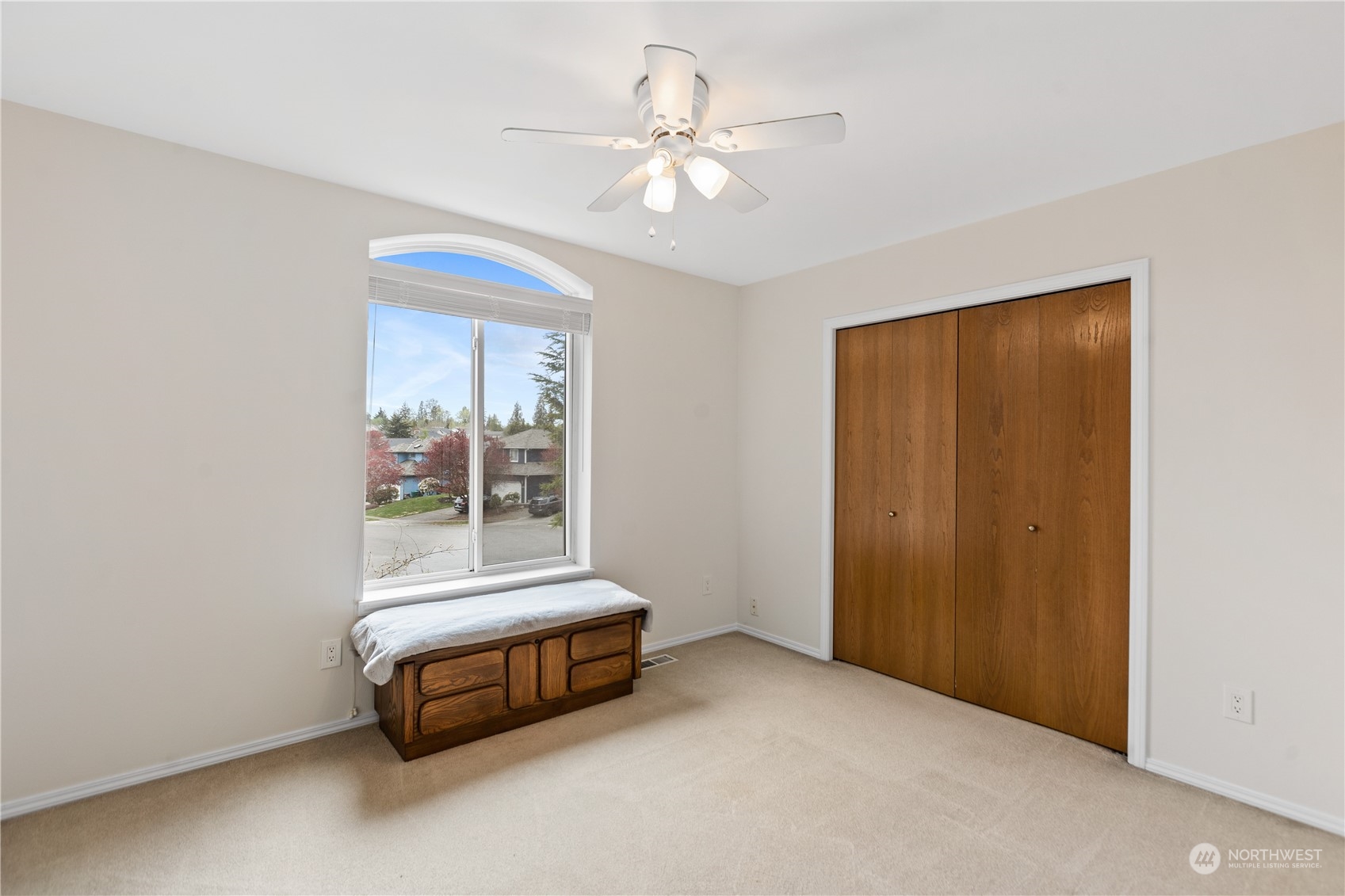 5316 152nd Place Southeast Everett, WA 98208 - Photo 21 of 37 an empty room with chandelier fan and windows