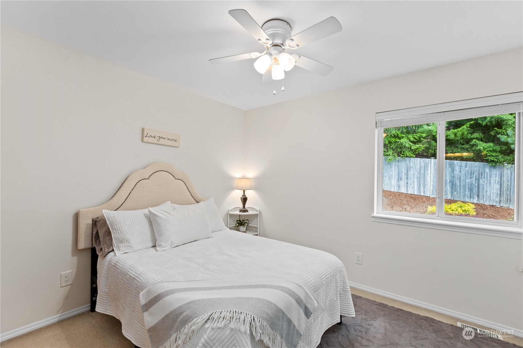 5316 152nd Place Southeast Everett, WA 98208 - Photo 26 of 37 a bedroom with a bed and a chandelier