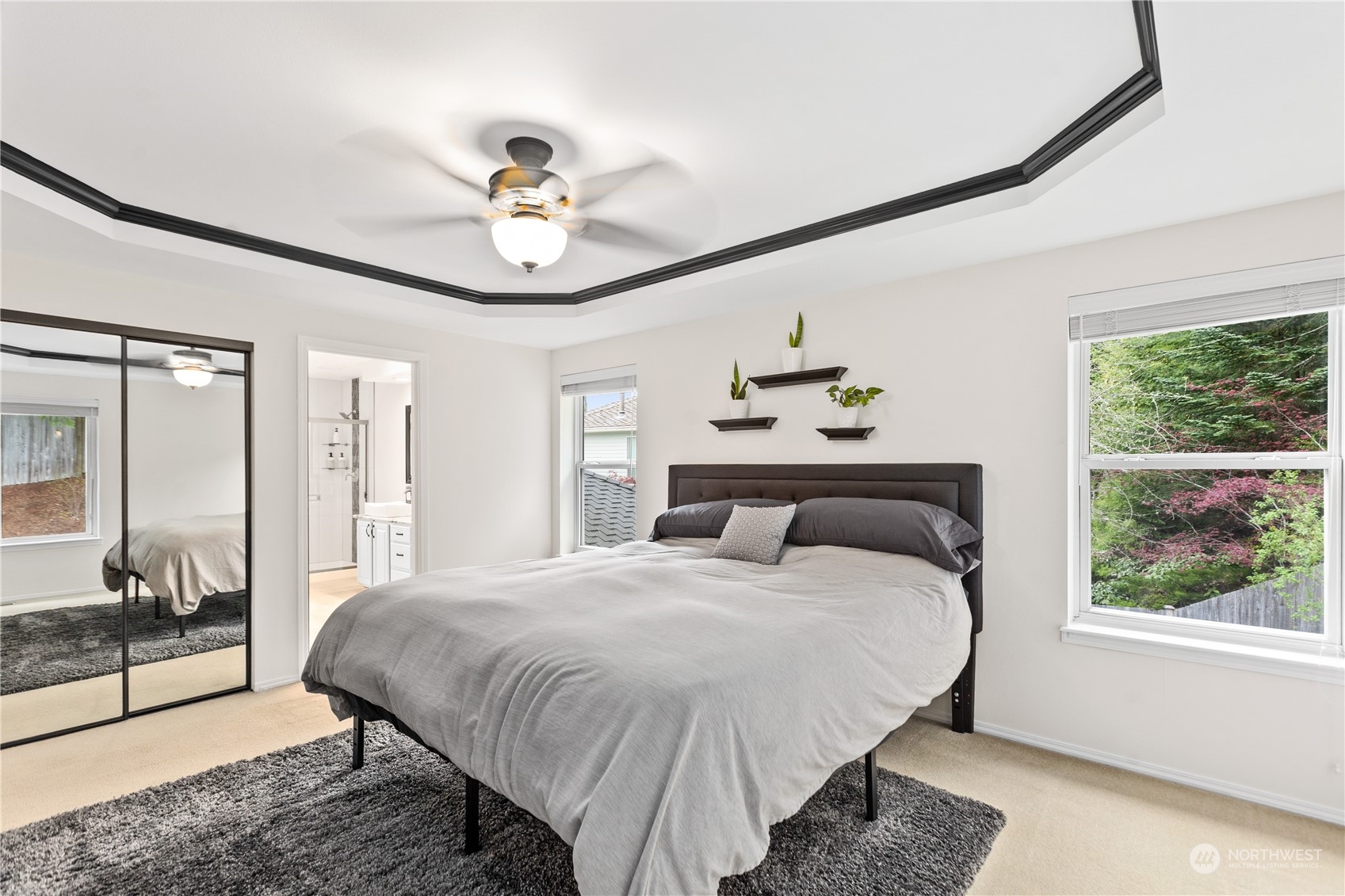 5316 152nd Place Southeast Everett, WA 98208 - Photo 29 of 37 a bedroom with a bed and a chandelier