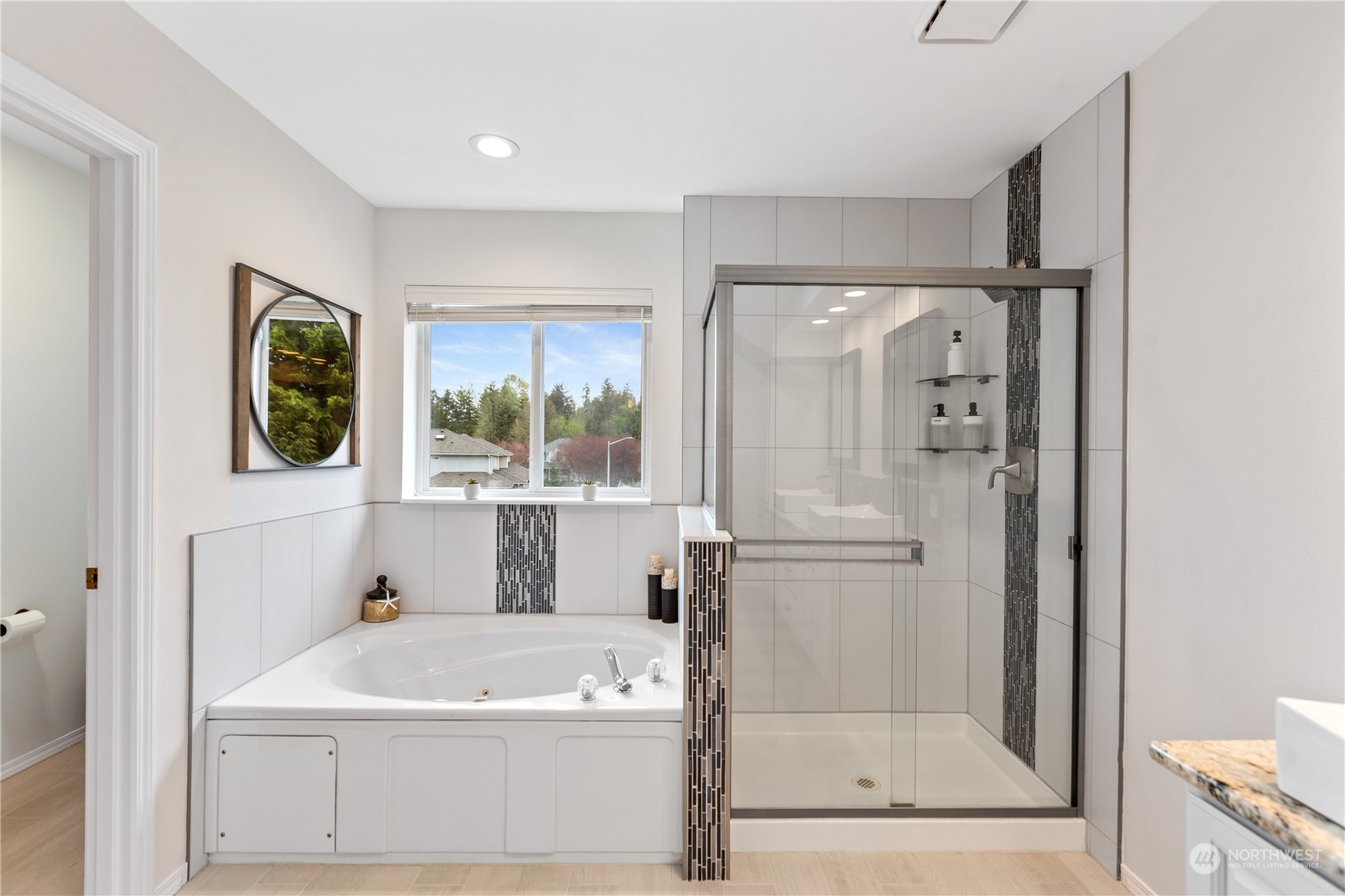 5316 152nd Place Southeast Everett, WA 98208 - Photo 32 of 37 a bathroom with a tub a sink and a window