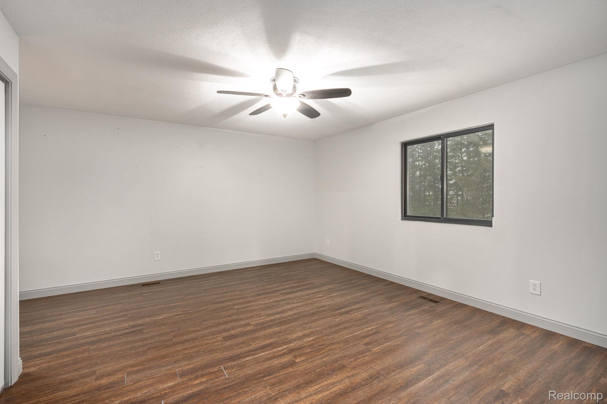 6803 Napoleon Road Jackson, MI 49201 - Photo 33 of 59 Master Bedroom Hard wood finished floors and ceiling fan, natural lightning