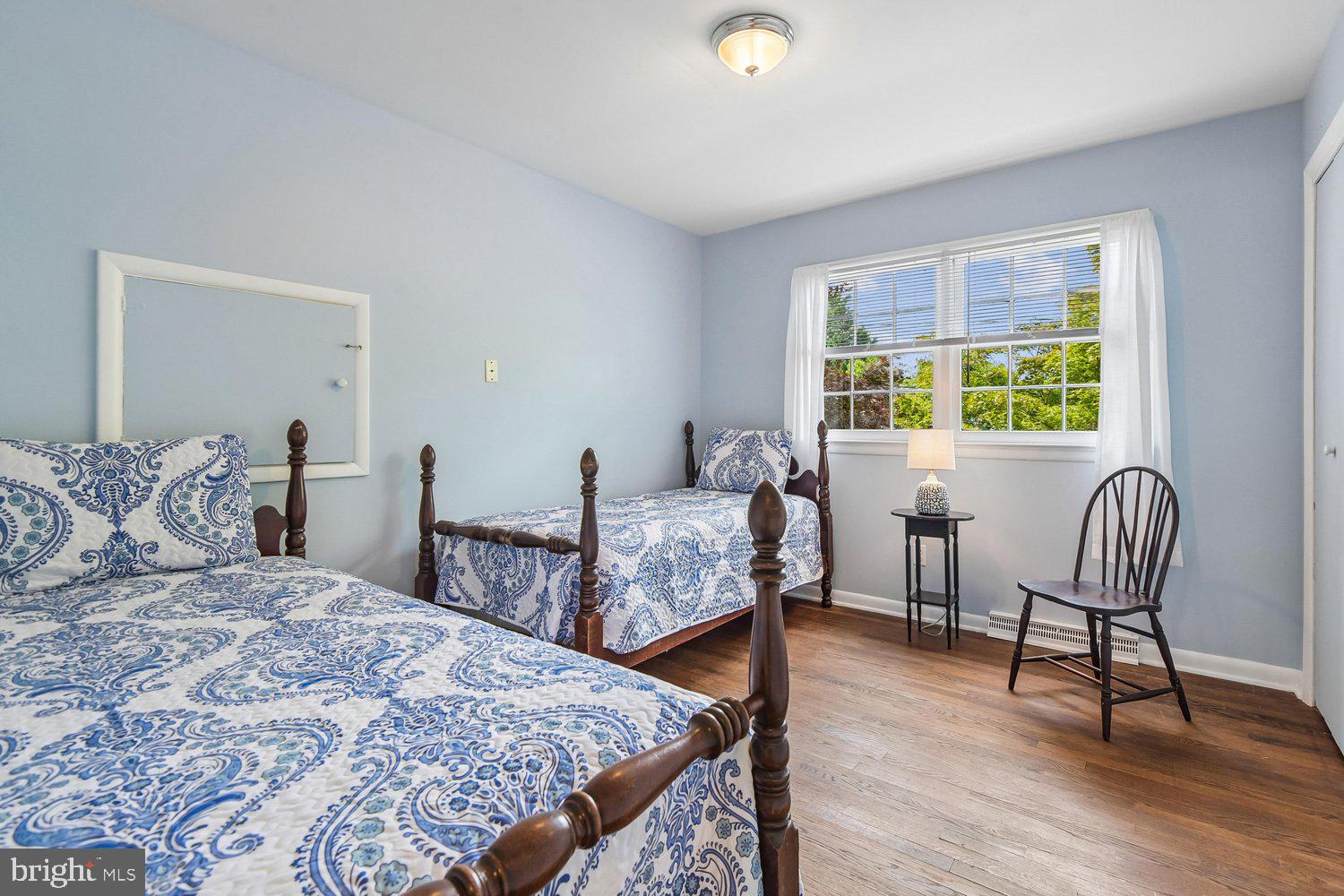 1518 Winchester Road Annapolis, MD 21409 - Photo 38 of 70 a bedroom with a bed and a chair