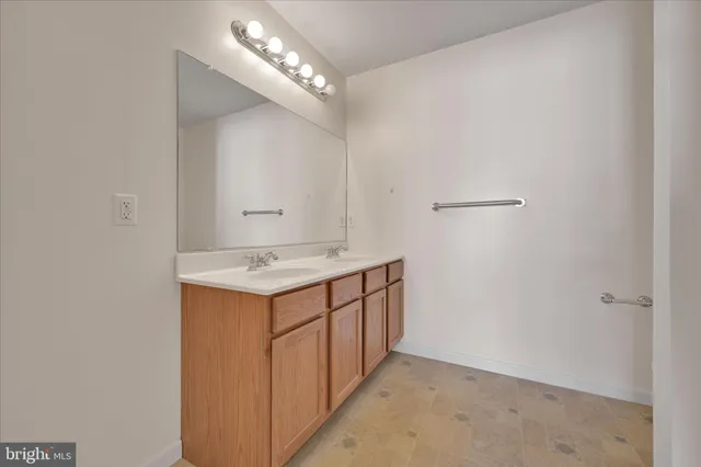 a utility room with cabinets washer and dryer