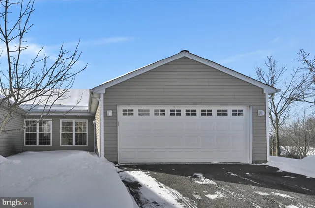 a front view of a house with a garage