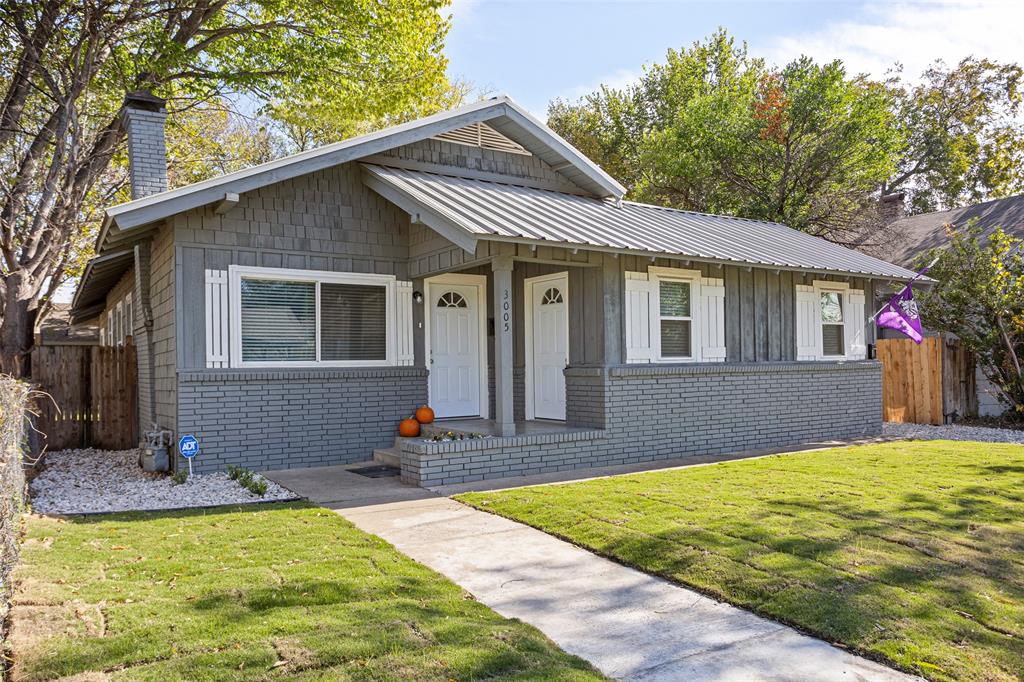 a view of a house with pool and sitting area