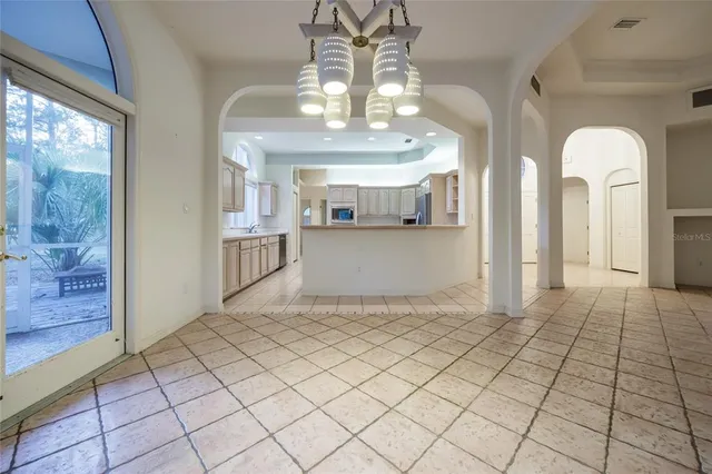 a kitchen with cabinets stainless steel appliances and a counter top space