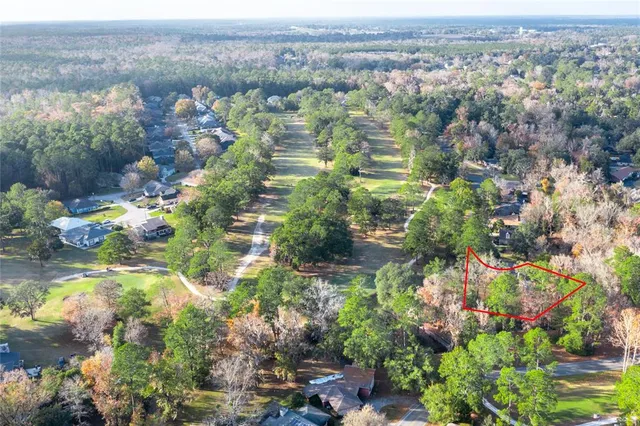 a view of a city with green field