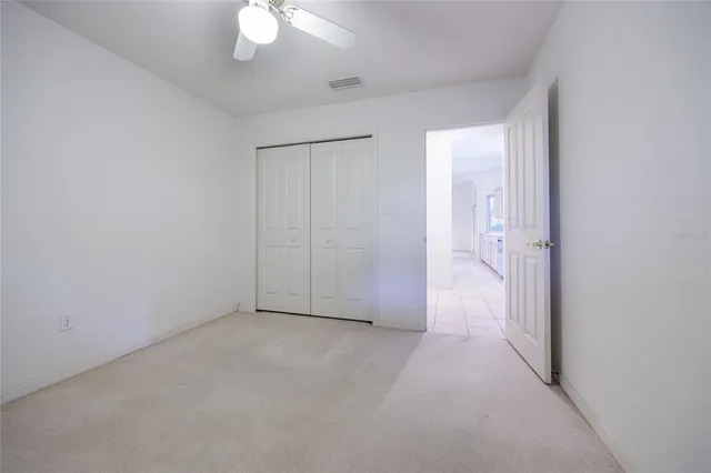 an empty room with fan