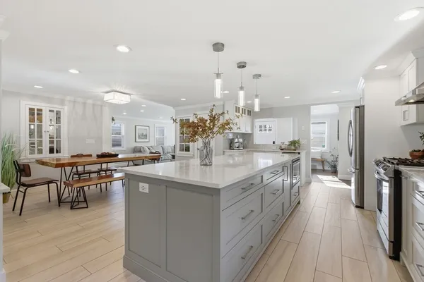 a view of a kitchen with workspace and entryway