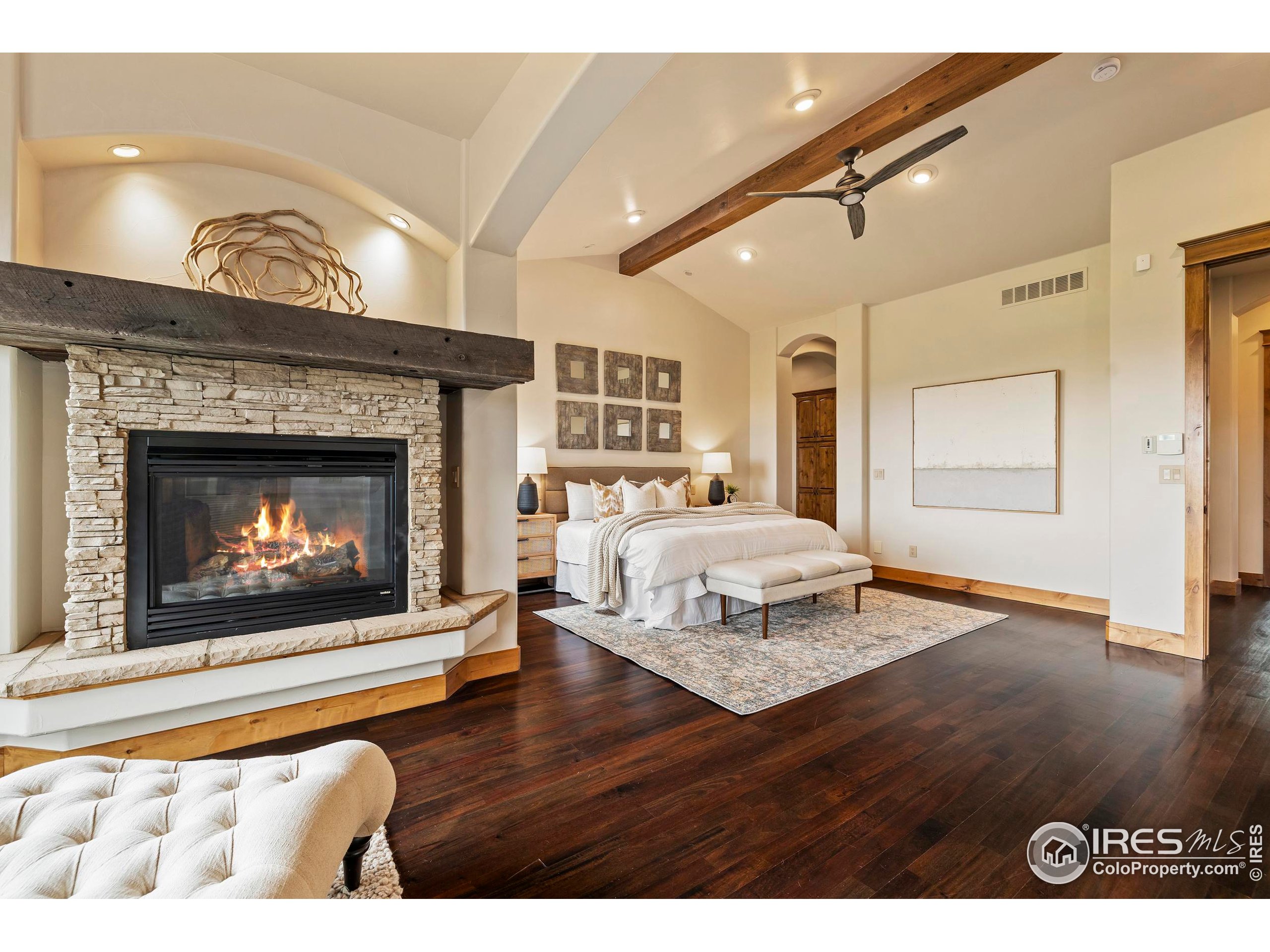 863 Riparian Way Fort Collins, CO 80524 - Photo 18 of 38 a bedroom with a bed and a fireplace