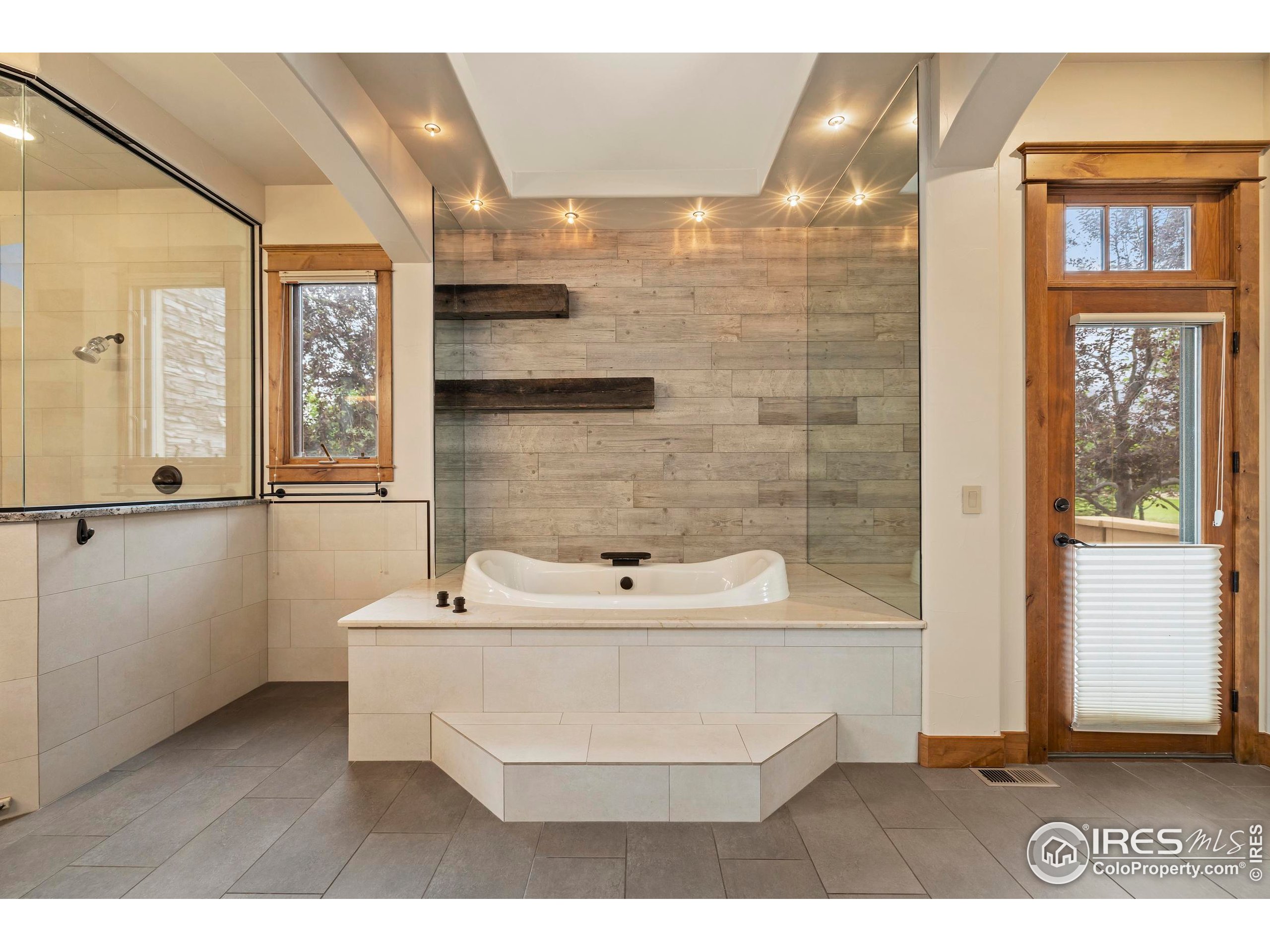 863 Riparian Way Fort Collins, CO 80524 - Photo 20 of 38 a bathroom with a sink a mirror and shower