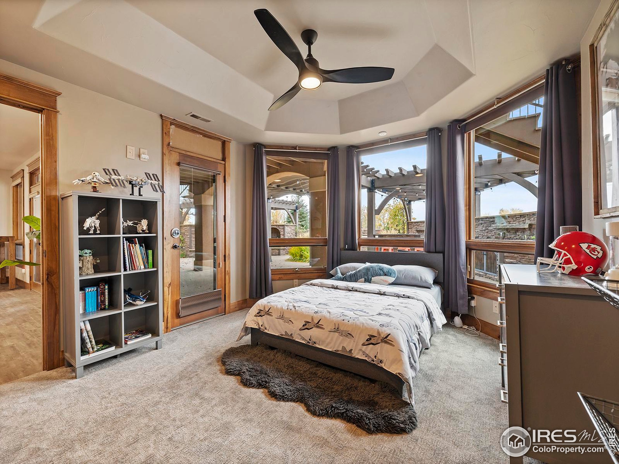 863 Riparian Way Fort Collins, CO 80524 - Photo 31 of 38 a bed sitting in a room next to a window