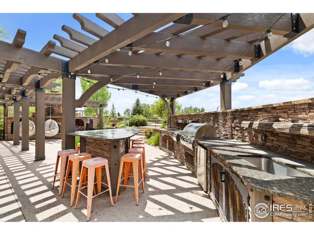 a view of a chairs and table in patio