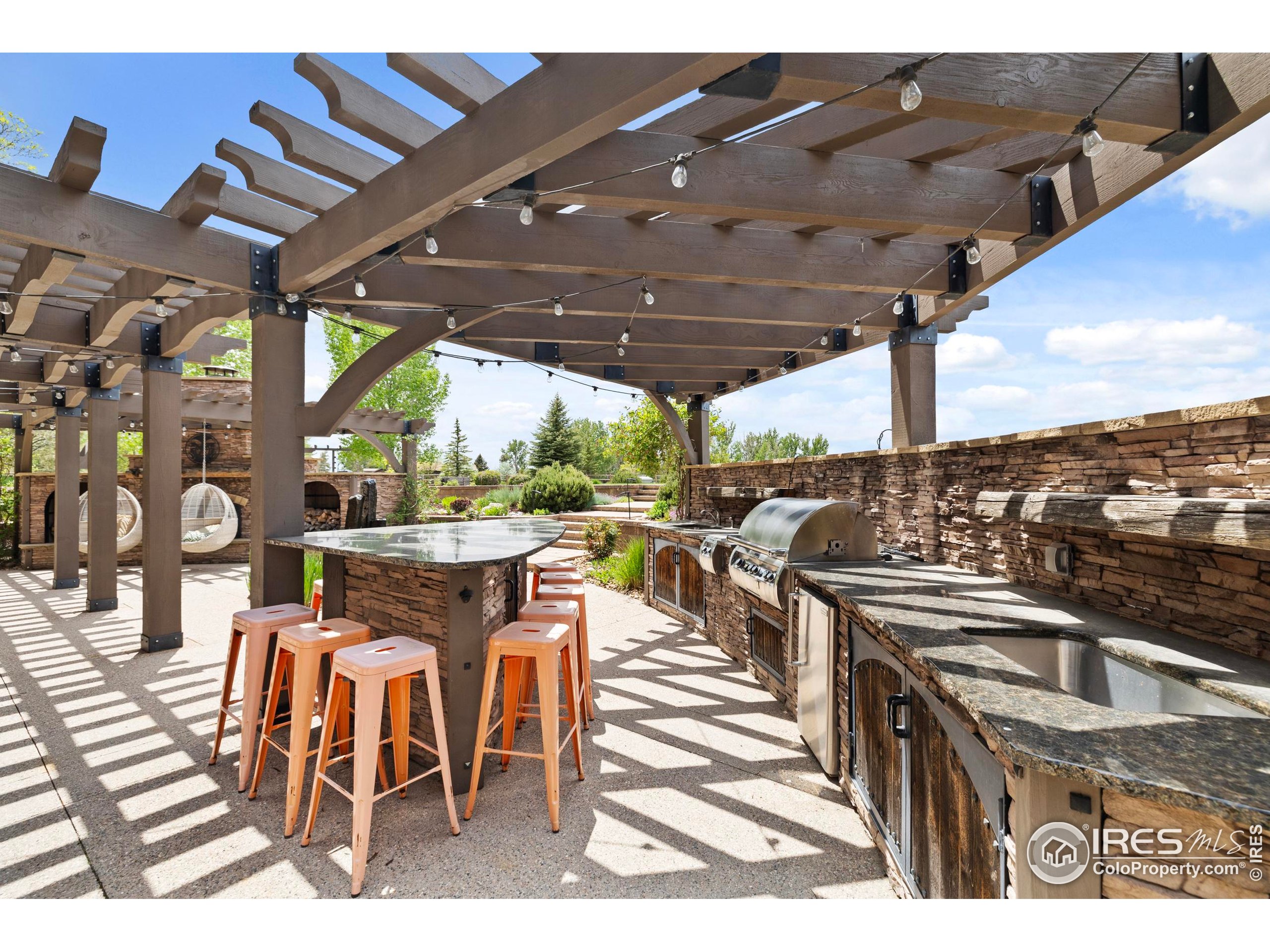 863 Riparian Way Fort Collins, CO 80524 - Photo 34 of 38 a view of a chairs and table in patio