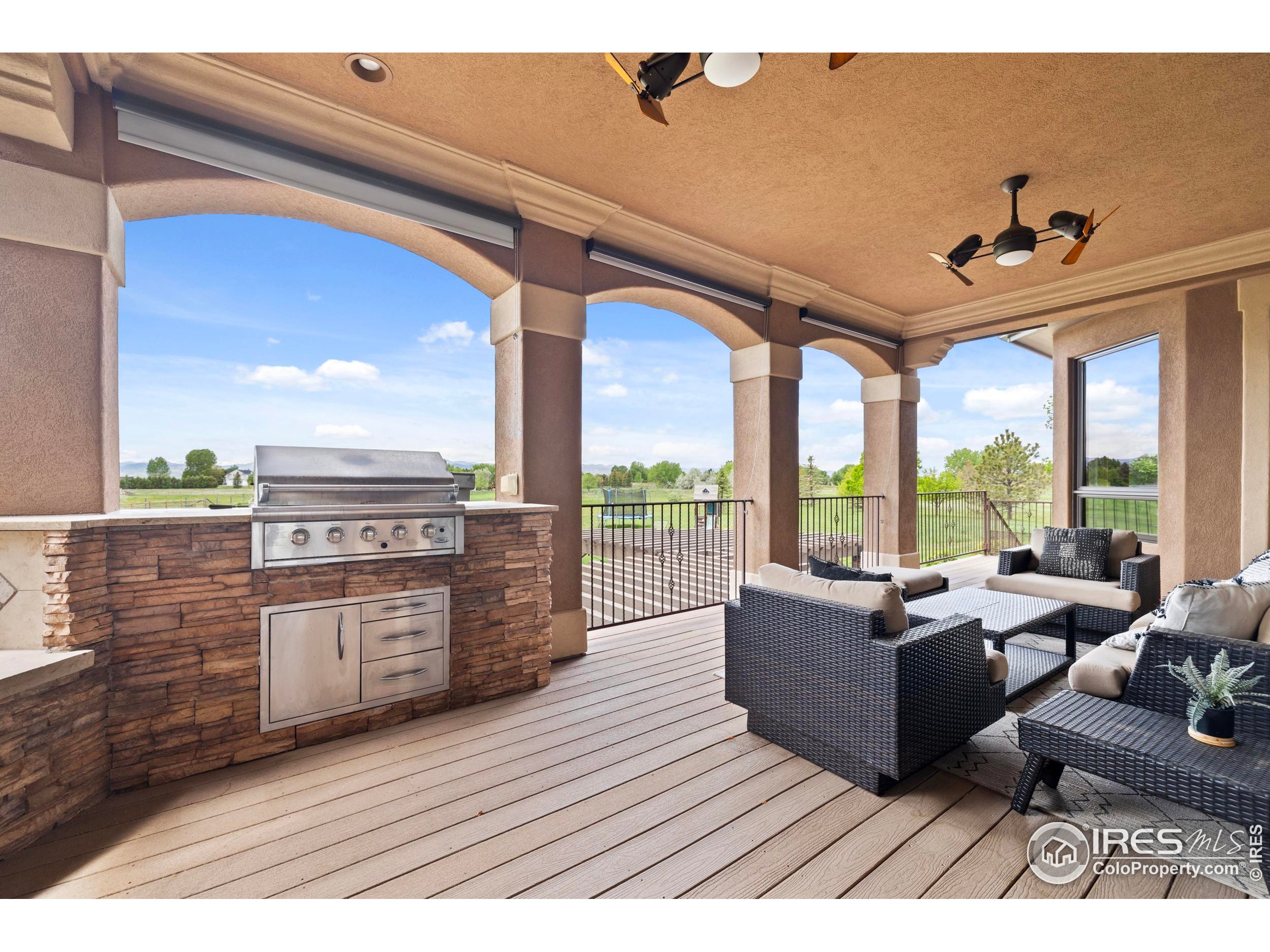 863 Riparian Way Fort Collins, CO 80524 - Photo 35 of 38 a living room with furniture and large windows