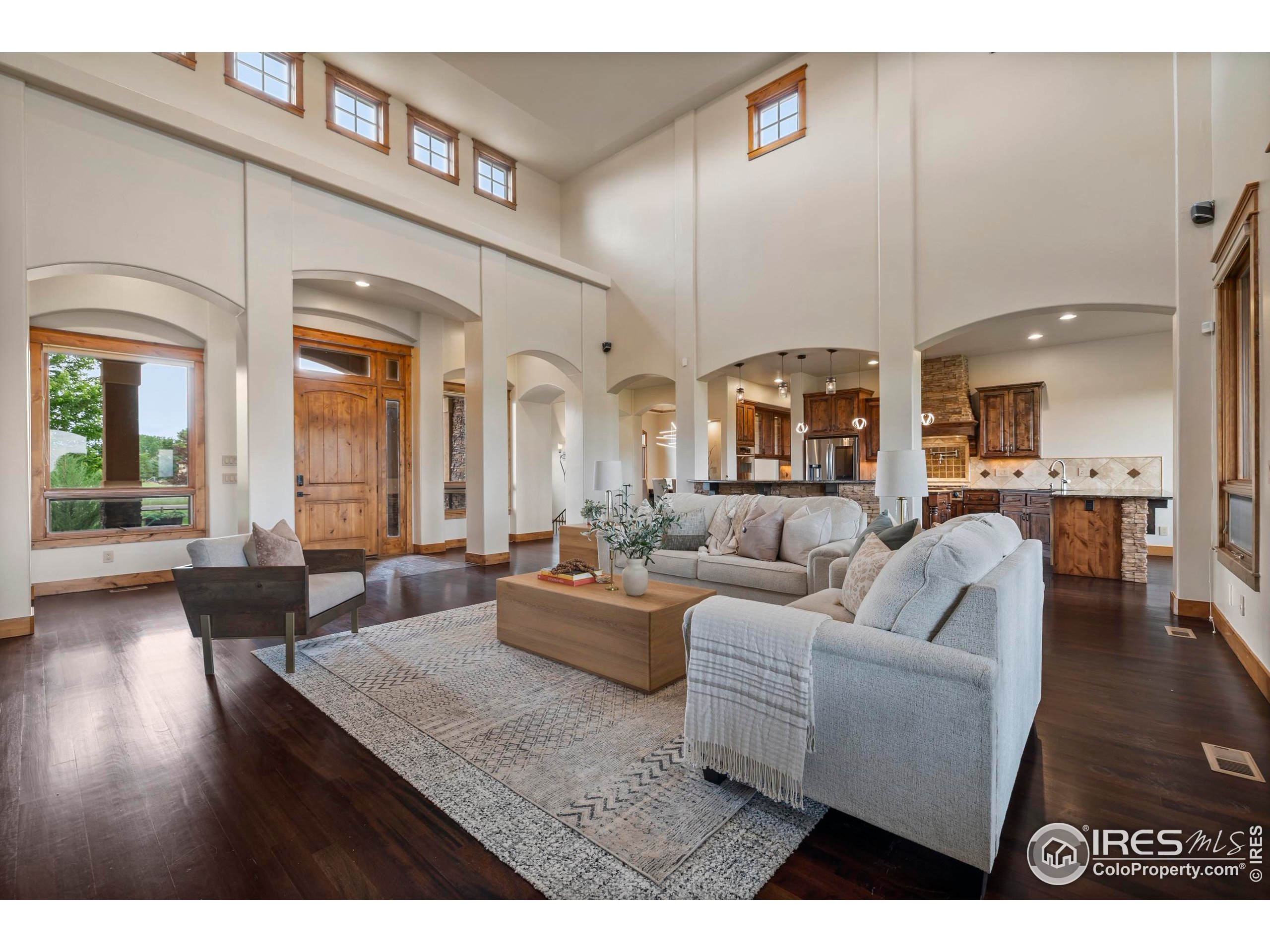 863 Riparian Way Fort Collins, CO 80524 - Photo 6 of 38 a living room with furniture and a large window
